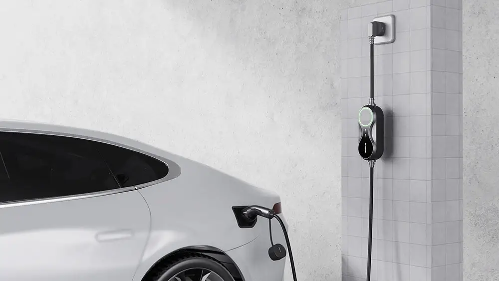 Electric car being charged with portable ev charger